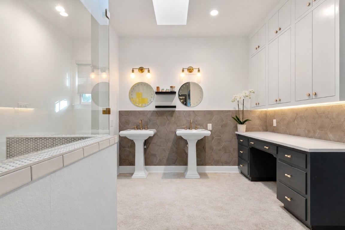 2106 Eva Street Austin, TX 78704 - Photo 10 of 13 a kitchen with stainless steel appliances a sink and a refrigerator