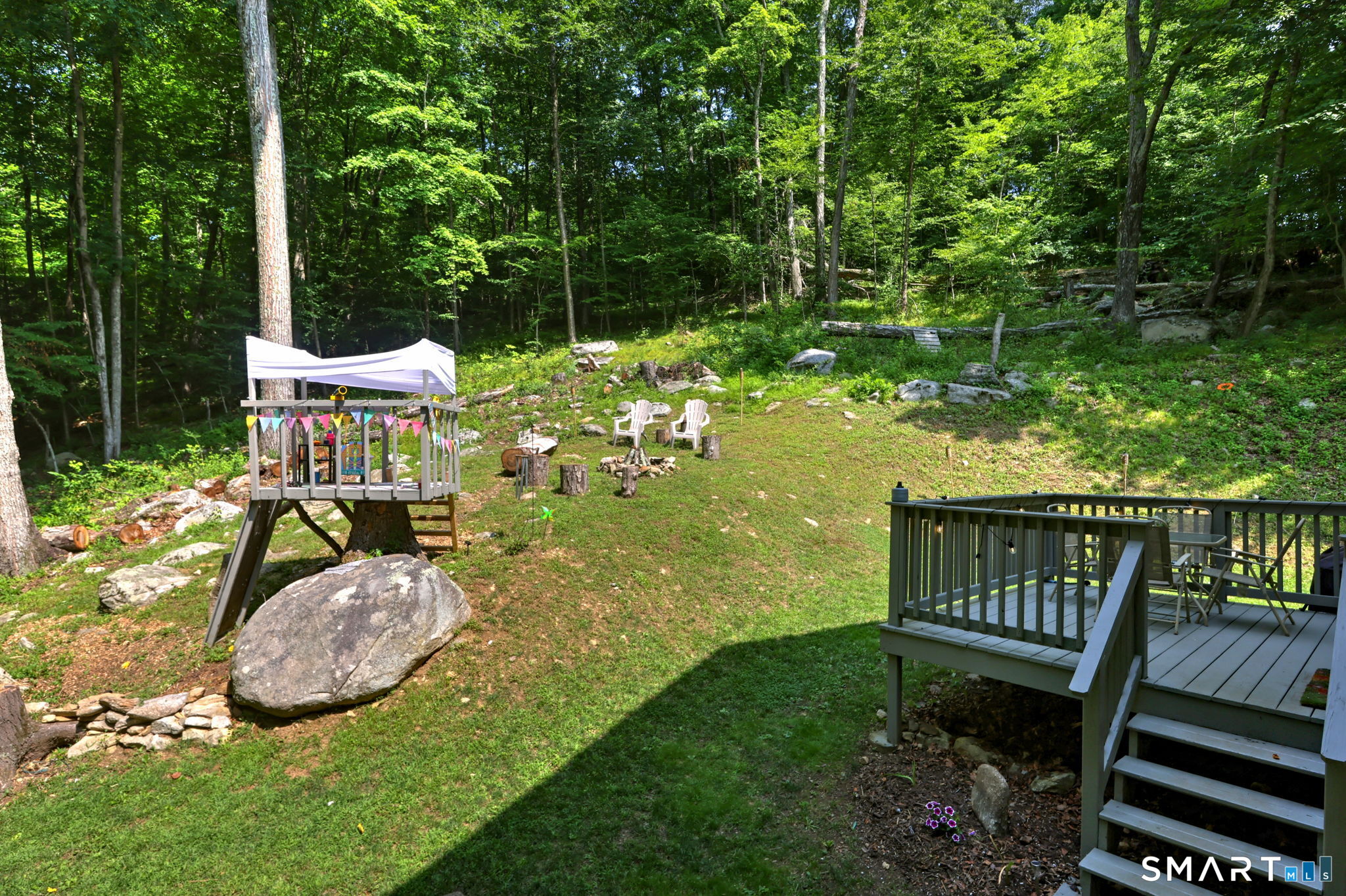 35 Charles Road Seymour, CT 06483 - Photo 29 of 33 Whether roasting marshmallows, watching the kids play, or relaxing beneath the trees, this backyard invites you to enjoy every season.