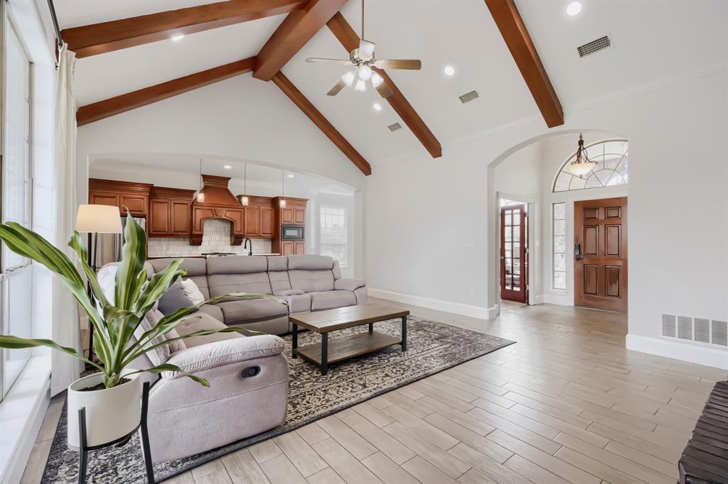 603 Ash Street Pilot Point, TX 76258 - Photo 6 of 28 Vaulted ceiling with exposed wood beams and recessed lighting