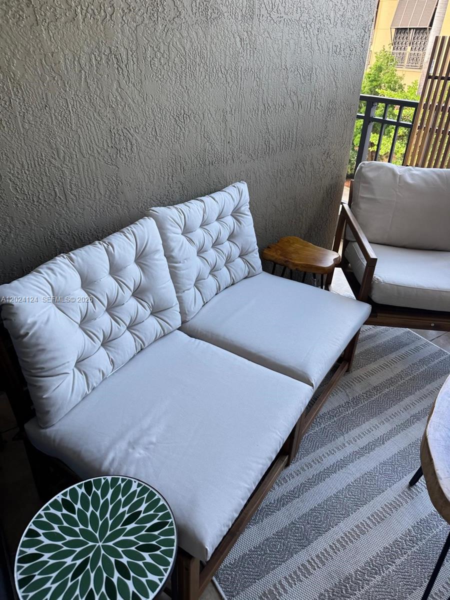120 South Douglas Road, Unit 302 Miami, FL 33134 - Photo 20 of 28 a living room with furniture