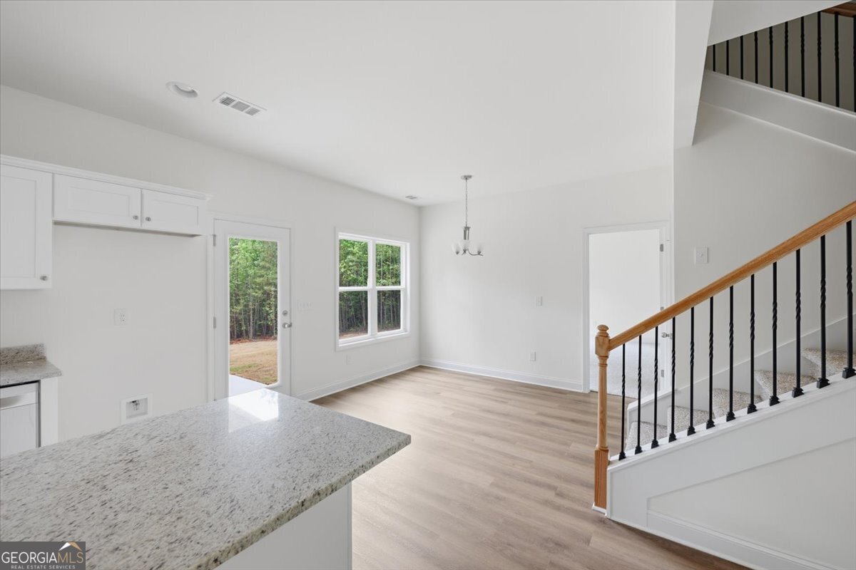 2778 Boxankle Road Forsyth, GA 31029 - Photo 8 of 21 a view of an empty room with wooden floor and a window