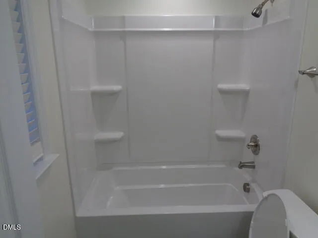 a bathroom with a toilet and a sink