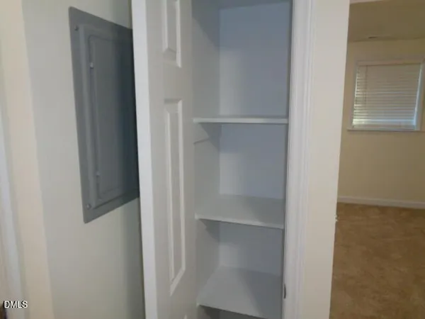 a view of wooden floor and brick walls