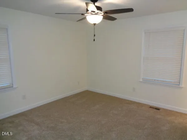 a view of a chandelier fan in a room