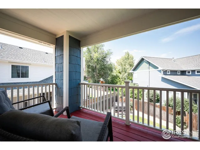 a view of balcony with wooden floor