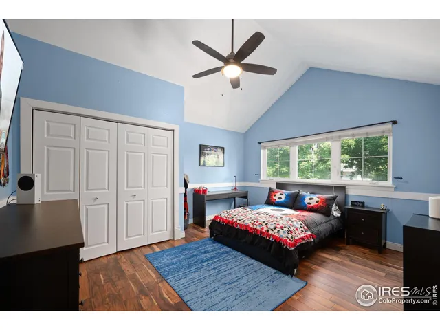 a bedroom with a bed and a table with closet