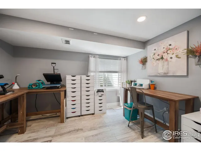 a view of a workspace with furniture