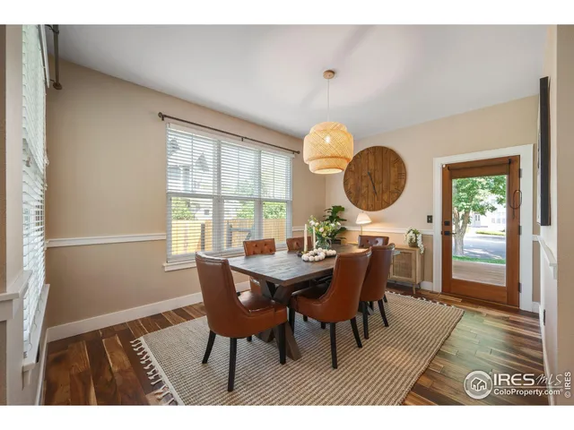 a view of a dining room with furniture and window