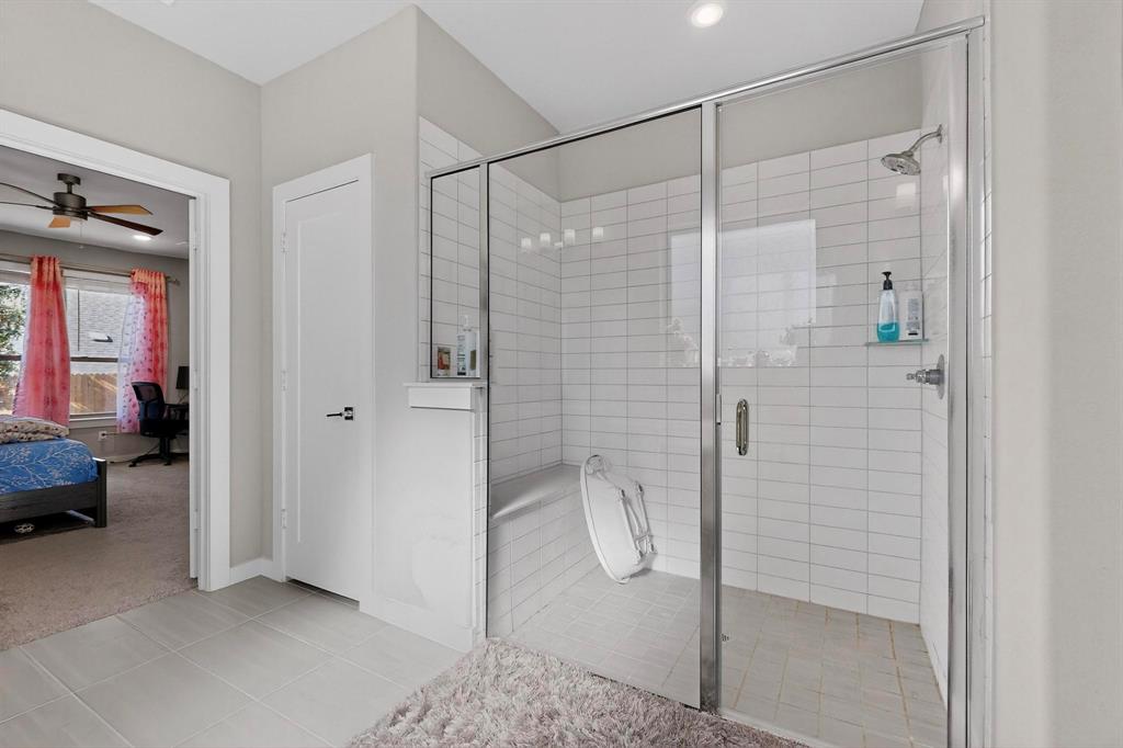4036 Fanleaf Loop Melissa, TX 75454 - Photo 11 of 19 a bathroom with a shower and a sink