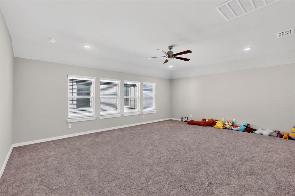 4036 Fanleaf Loop Melissa, TX 75454 - Photo 17 of 19 an empty room with windows and ceiling fan