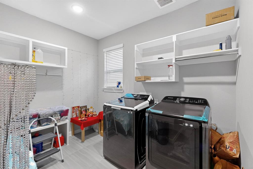 4036 Fanleaf Loop Melissa, TX 75454 - Photo 18 of 19 a utility room with sink dryer and washer