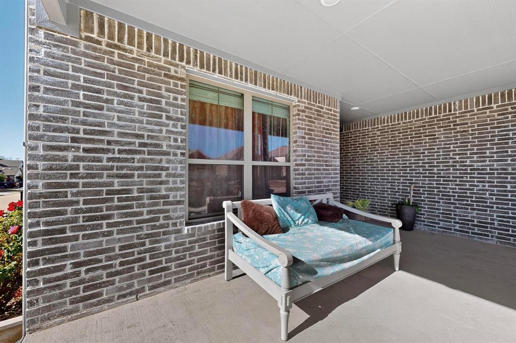 4036 Fanleaf Loop Melissa, TX 75454 - Photo 19 of 19 a blue bench sitting in front of a door