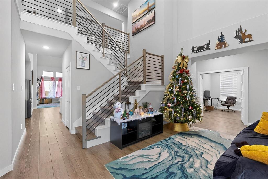 4036 Fanleaf Loop Melissa, TX 75454 - Photo 3 of 19 a living room with furniture and flowers