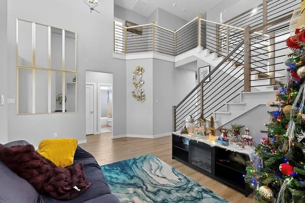 a living room with furniture and a potted plant