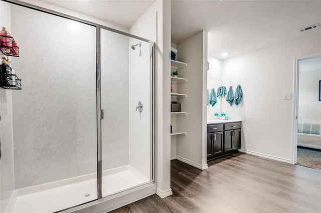 a bathroom with a shower and a tub