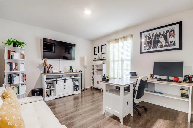 a workspace with furniture and a flat screen tv