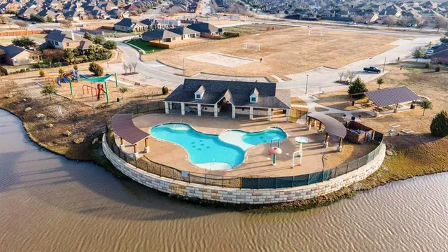 a view of a swimming pool with lounge chair