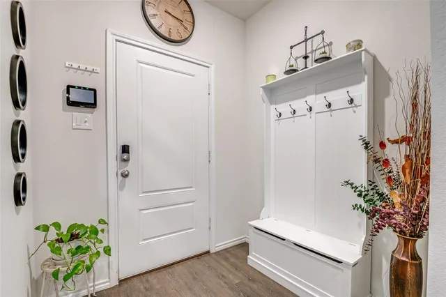 a hallway with painting on the wall