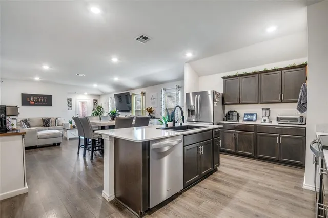 a kitchen with lots of counter top space and appliances