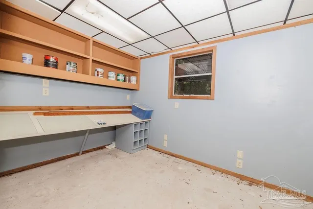 a view of a kitchen with a sink and a refrigerator