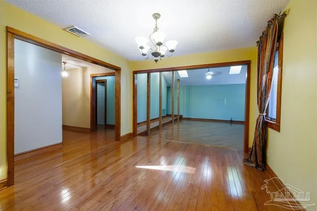 a view of livingroom with hardwood floor and hallway