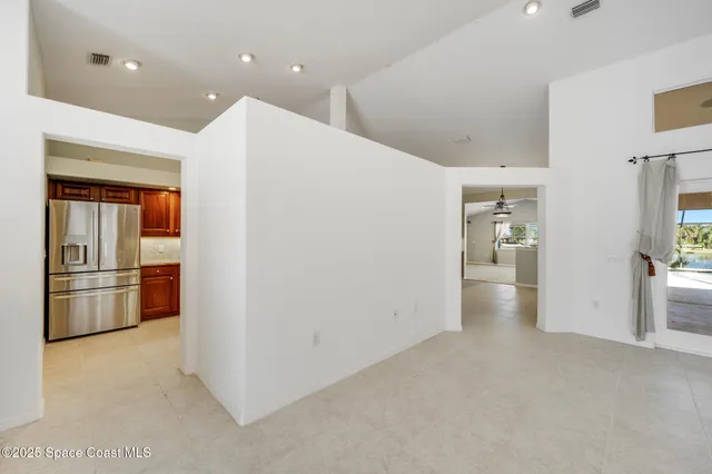 a view of a big room with closet wooden floor and windows