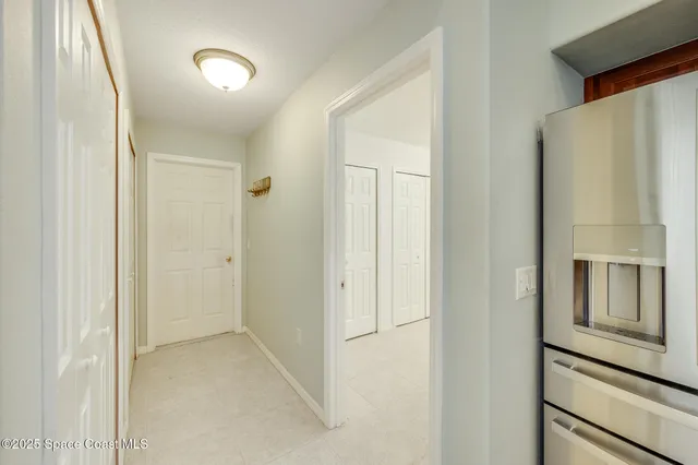 a view of living room kitchen with furniture and wooden floor