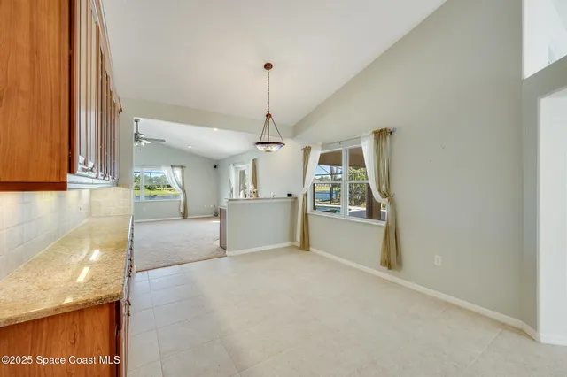 a kitchen with sink cabinets and stove top oven