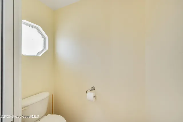 a view of a room with a large window