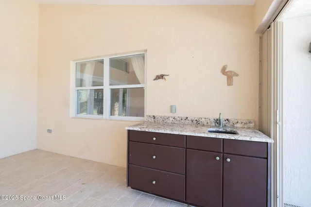 a view of a backyard with sitting area