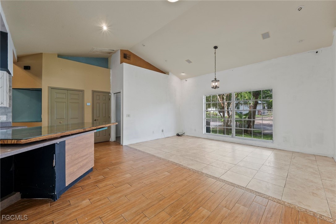 1981 Carbonata Drive Alva, FL 33920 - Photo 15 of 50 a view of an empty room with wooden floor and a window