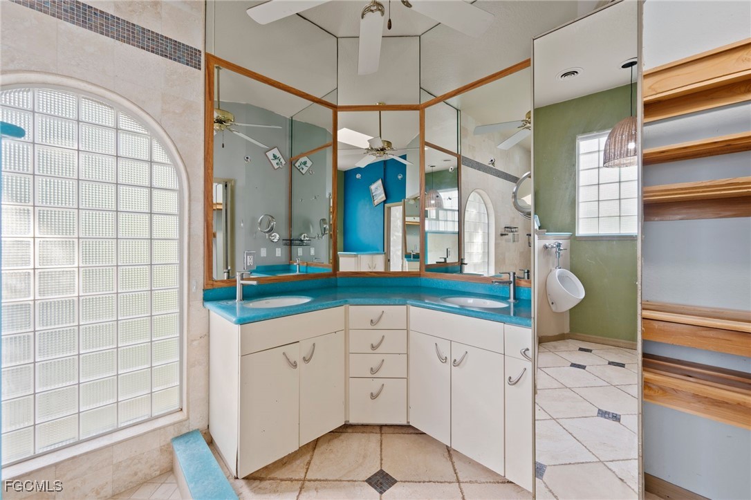 1981 Carbonata Drive Alva, FL 33920 - Photo 18 of 50 a bathroom with a sink a mirror and a shower