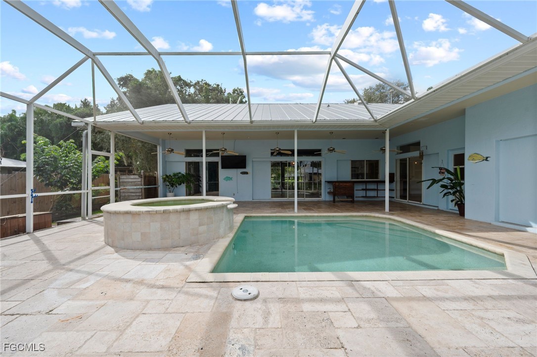 1981 Carbonata Drive Alva, FL 33920 - Photo 2 of 50 a swimming pool with outdoor seating and yard
