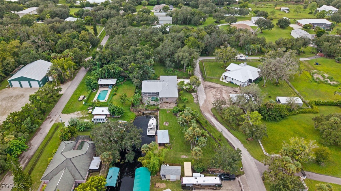 1981 Carbonata Drive Alva, FL 33920 - Photo 43 of 50 an aerial view of a house with a yard and lake view