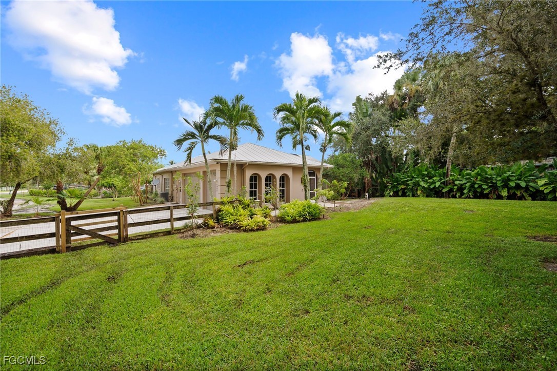 1981 Carbonata Drive Alva, FL 33920 - Photo 50 of 50 a view of a house with garden and a tree