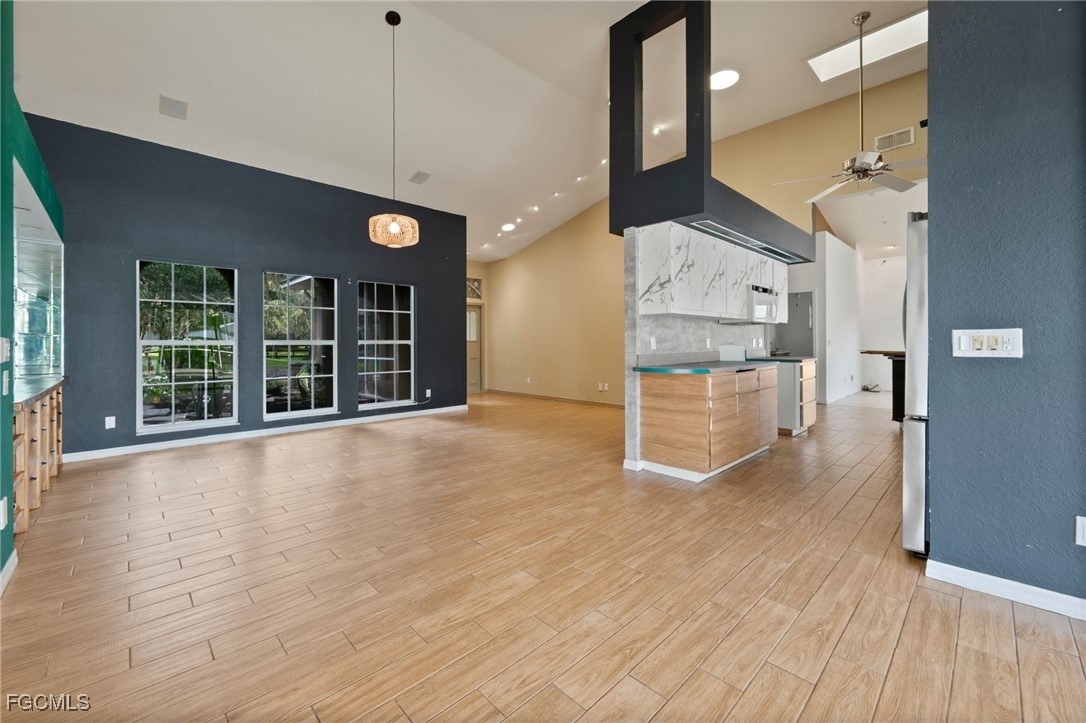 1981 Carbonata Drive Alva, FL 33920 - Photo 7 of 50 a view of an empty room with a window and wooden floor