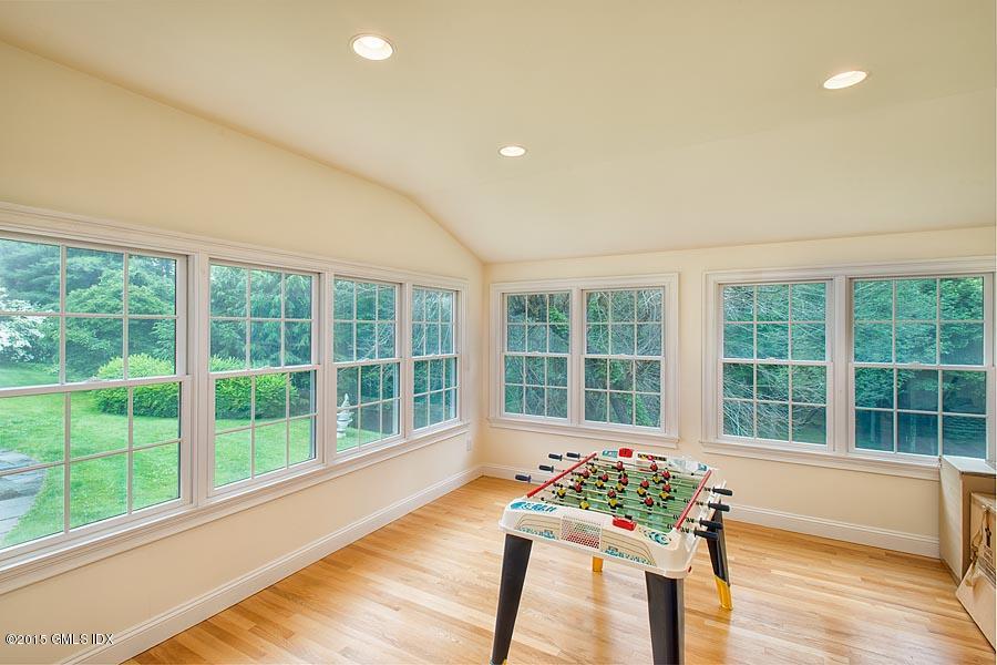 108 Cutler Road Greenwich, CT 06831 - Photo 11 of 15 a living room with furniture and a large window