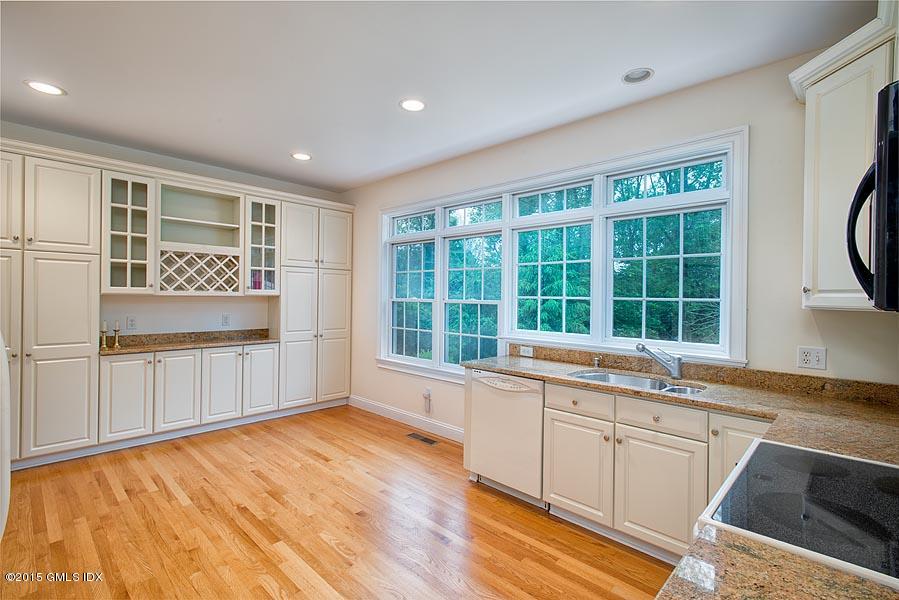 108 Cutler Road Greenwich, CT 06831 - Photo 5 of 15 a view of a kitchen with a sink and dishwasher with wooden floor