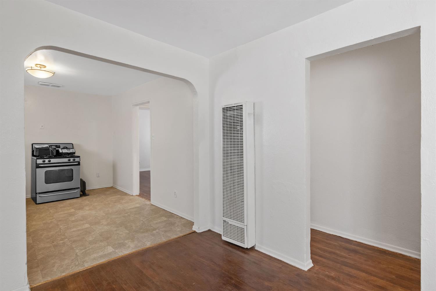 400 Scott Street Hanford, CA 93230 - Photo 11 of 35 a kitchen with a refrigerator and a stove top oven