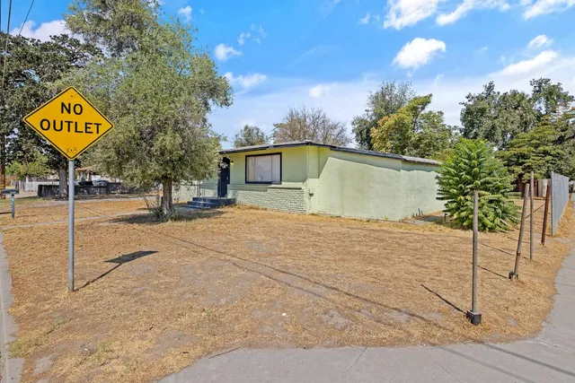 a sign board on the side of a road