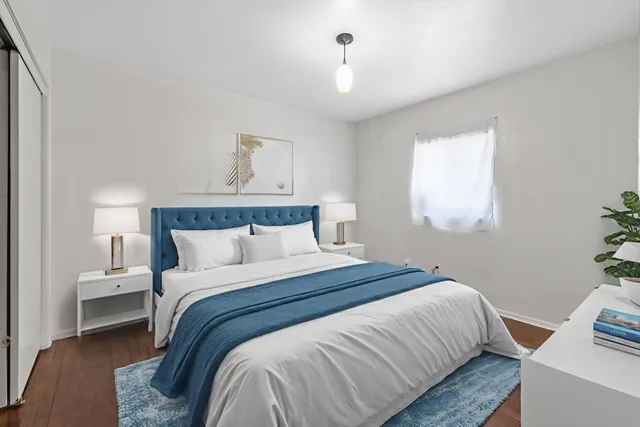 a bedroom with a bed and window