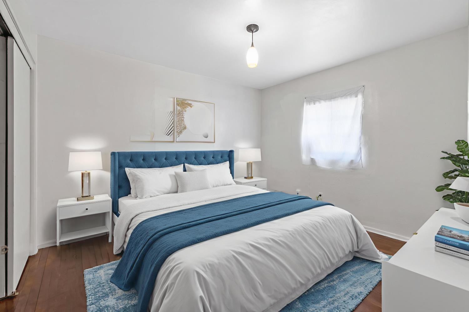 400 Scott Street Hanford, CA 93230 - Photo 22 of 35 a bedroom with a bed and window