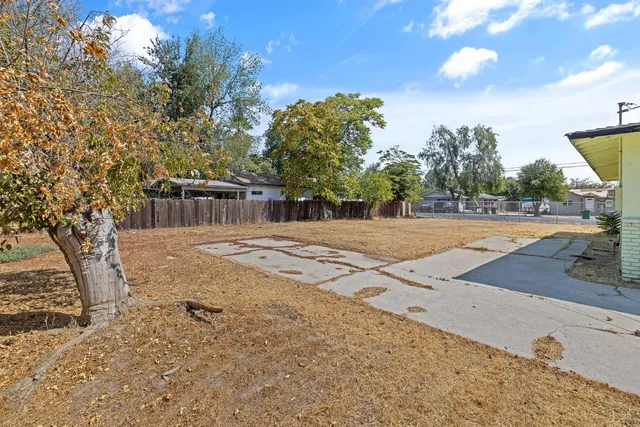 a backyard of a house with lots of green space