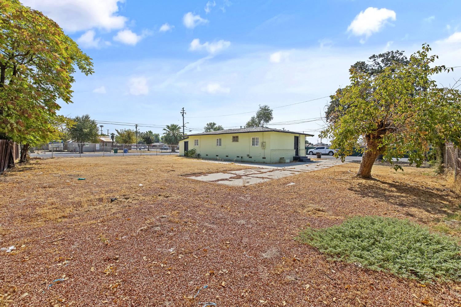 400 Scott Street Hanford, CA 93230 - Photo 31 of 35 a view of a field with trees in the background