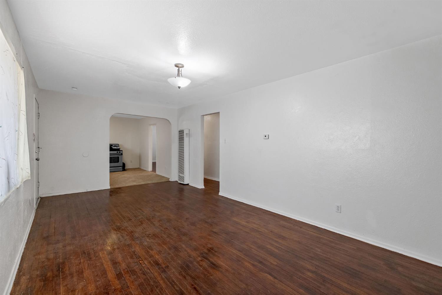 400 Scott Street Hanford, CA 93230 - Photo 9 of 35 a view of empty room with wooden floor