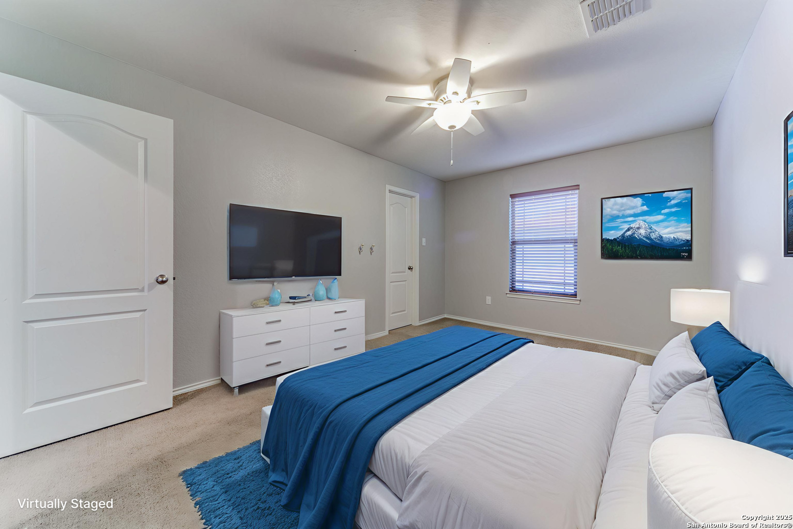 153 Rattlesnake Bluff Boerne, TX 78006 - Photo 13 of 18 a bedroom with a bed and a flat screen tv