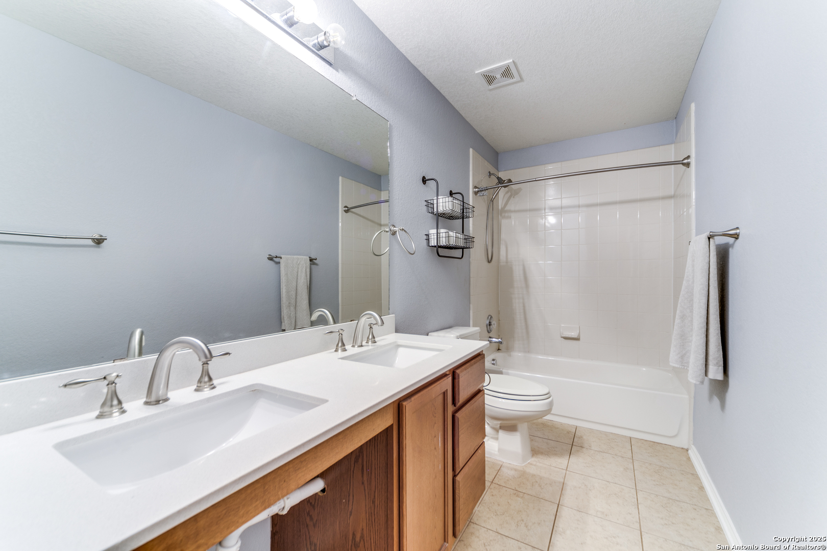 153 Rattlesnake Bluff Boerne, TX 78006 - Photo 14 of 18 a bathroom with a sink a toilet and shower