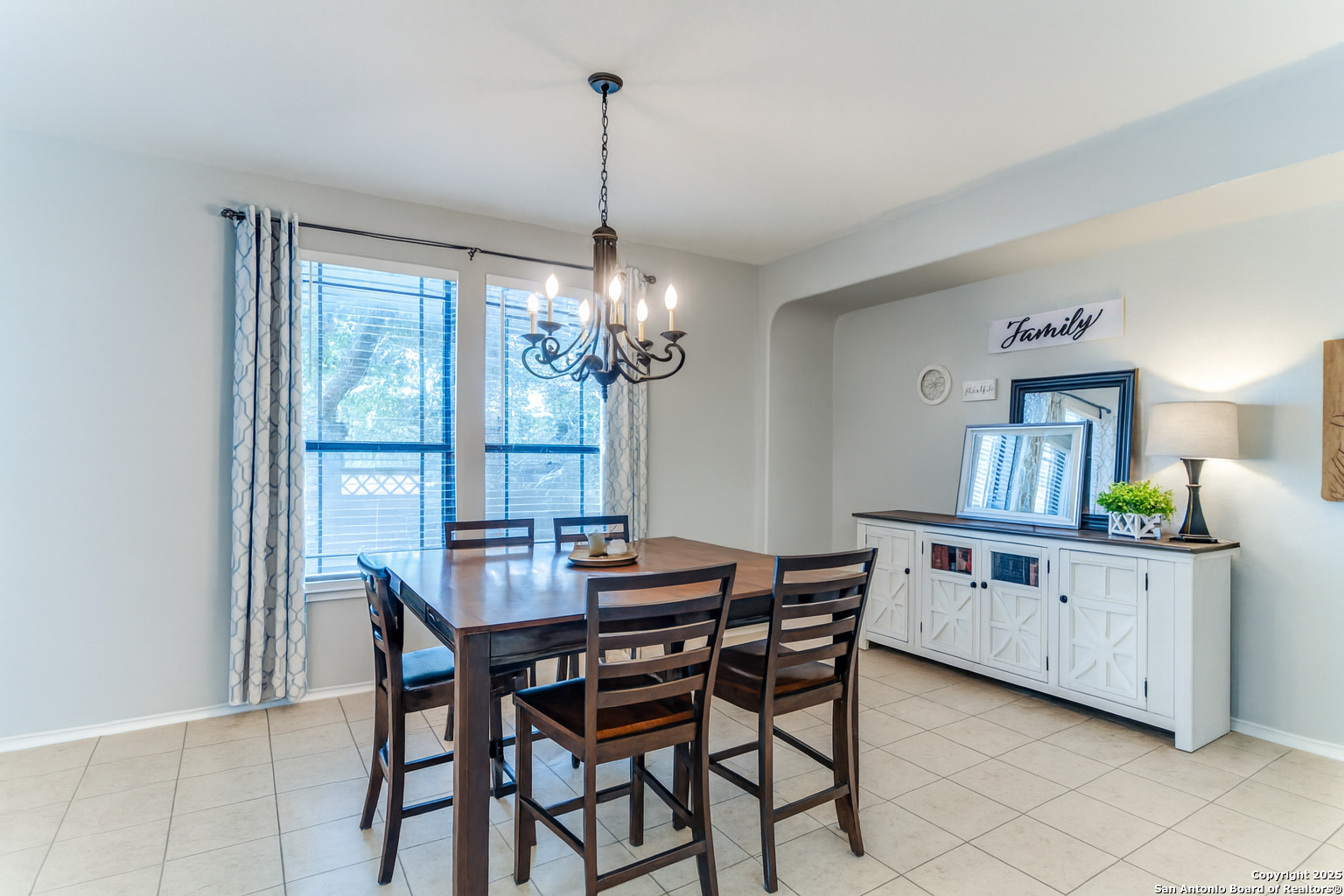 153 Rattlesnake Bluff Boerne, TX 78006 - Photo 3 of 18 a view of a dining room with furniture a chandelier and wooden floor