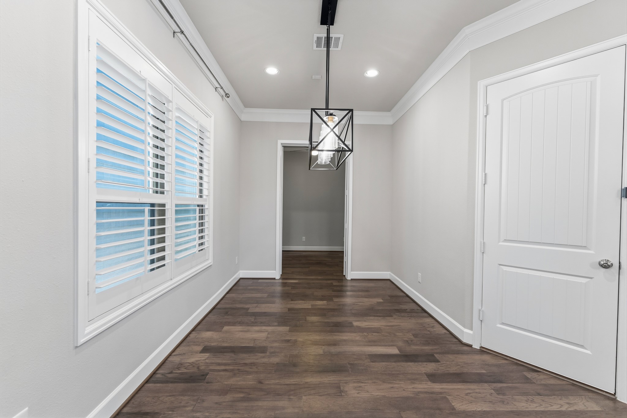 2607 Nicholson Street Houston, TX 77008 - Photo 11 of 29 a view of an empty room with wooden floor and a window