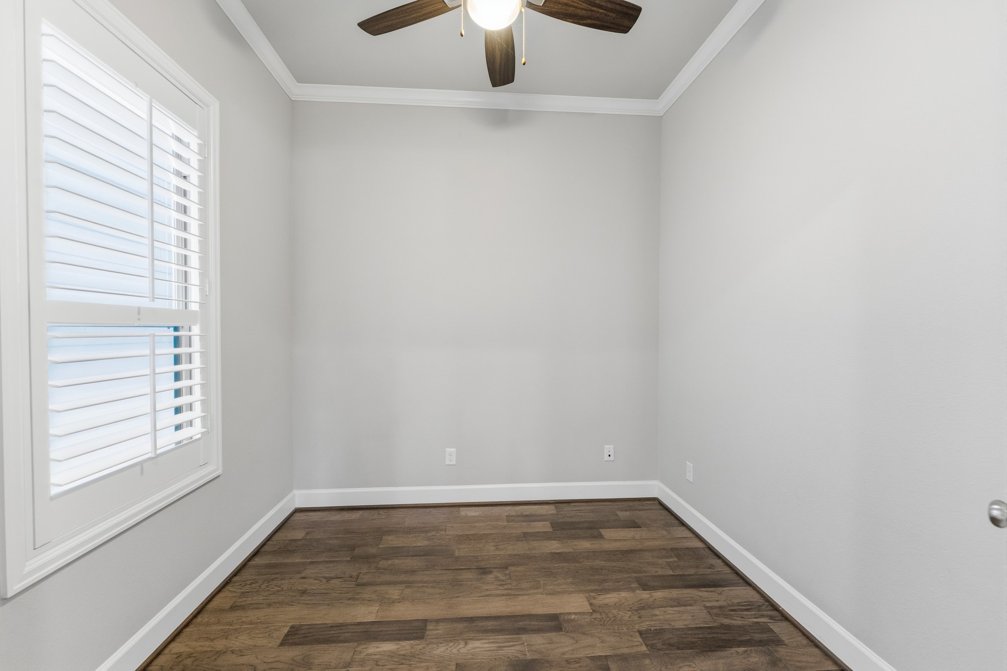 2607 Nicholson Street Houston, TX 77008 - Photo 12 of 29 a view of an empty room with window and wooden floor